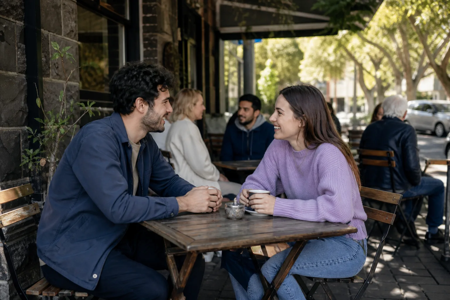 Two people talking over coffee in Oakham town centre